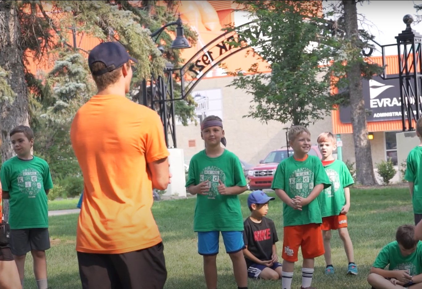 Kids getting instruction during the REAL District summer kid's camp in Confederation Park, Regina