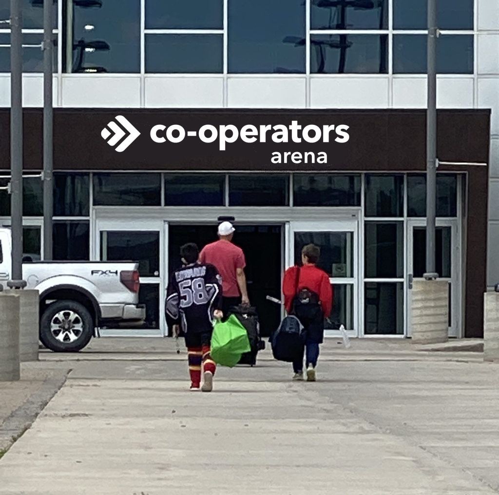 People enter Co-operators Arena with sports gear.